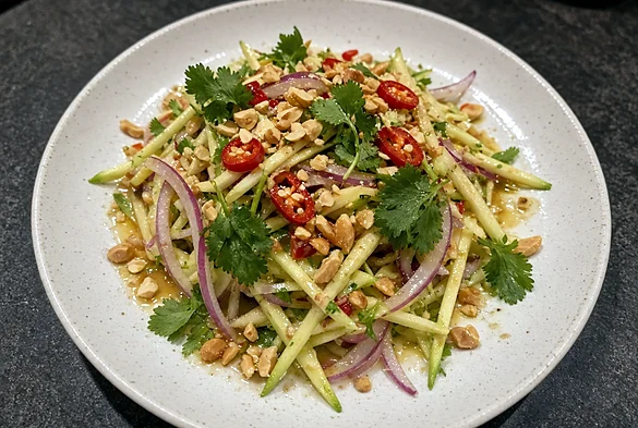 Mango salad with red onion, coriander, peanuts and red chilli