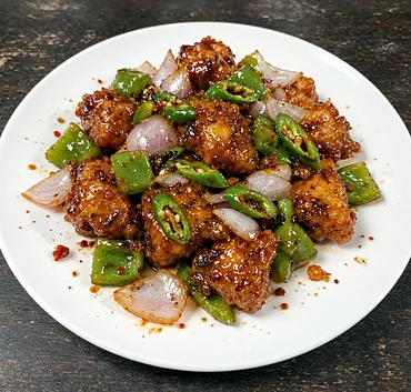 Chilli fish with green pepper, onion and green chillies