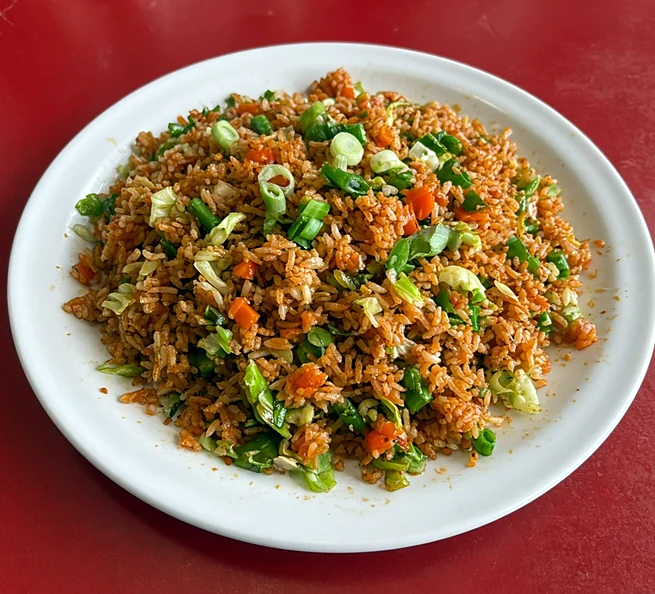 Vegetable Szechuan fried rice with carrot and spring onion
